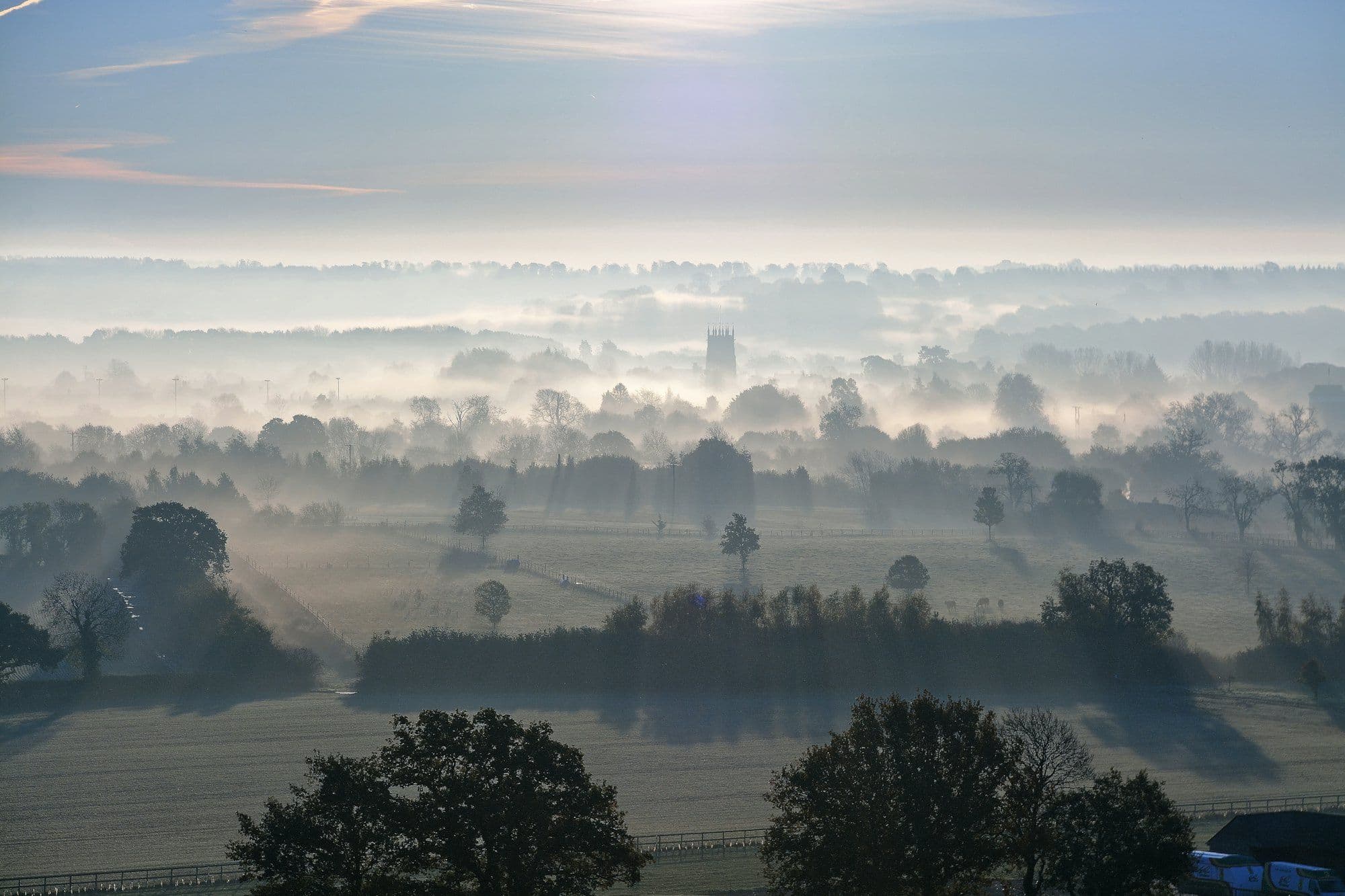 Misty English countryside at sunrise